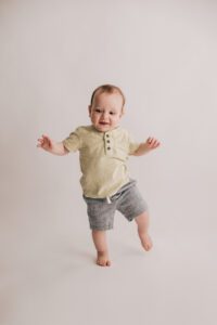 one year old baby toddling around
