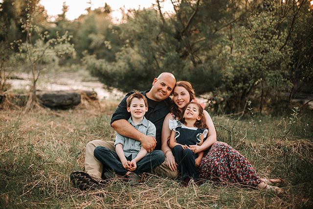 family photo in grass  | Raleigh Family Photography