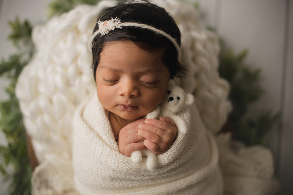 sweet newborn holding teddy bear raleigh photographer