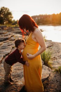 brother kissing belly cary maternity photographer