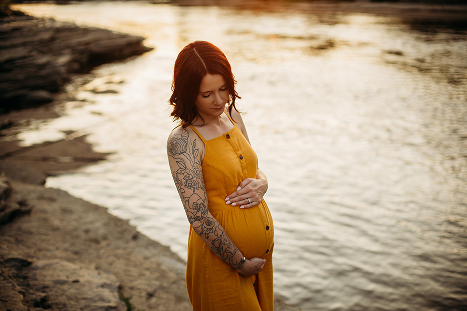 pregnant mom in yellow dress in water cary maternity photographer