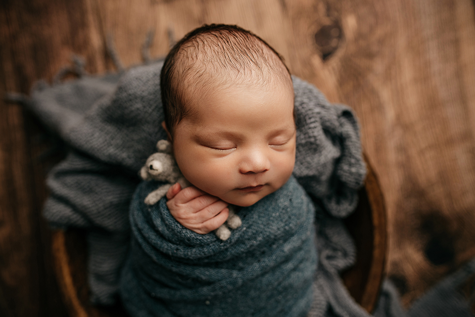 newborn boy with teddy bear