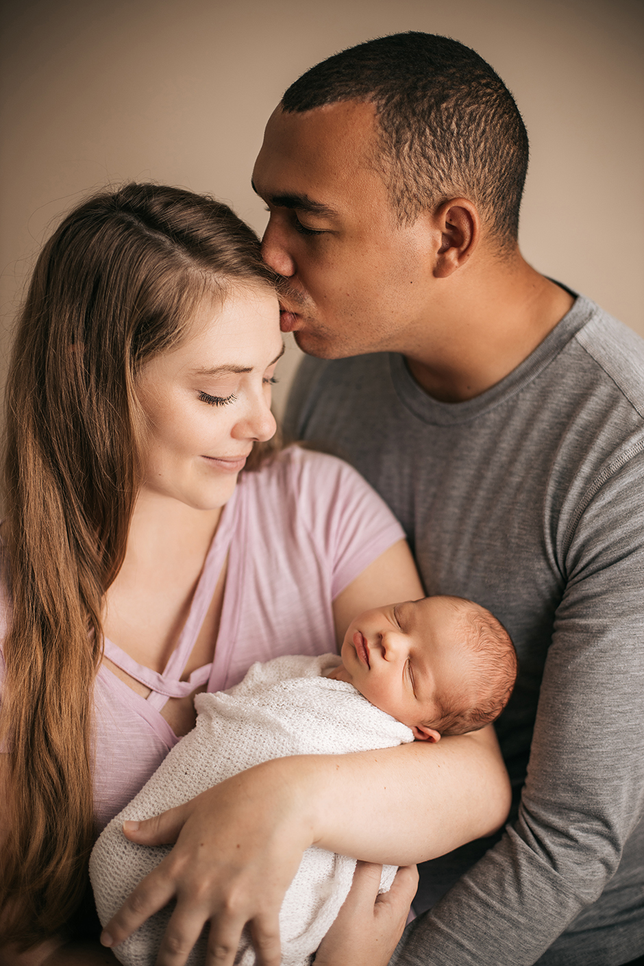 Intimate new parent photo with baby