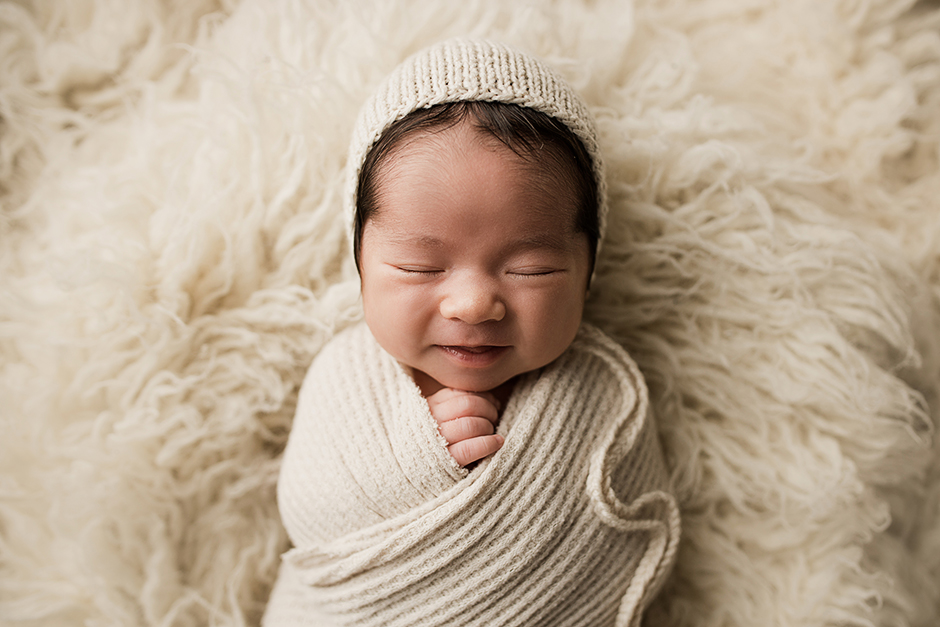 grinning newborn photo Cary NC