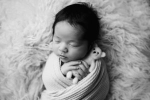 newborn with little teddy bear in Raleigh