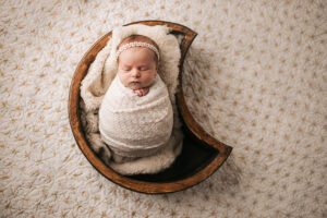 newborn baby in moon bowl, newborn photography apex