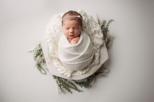 swaddled newborn apex