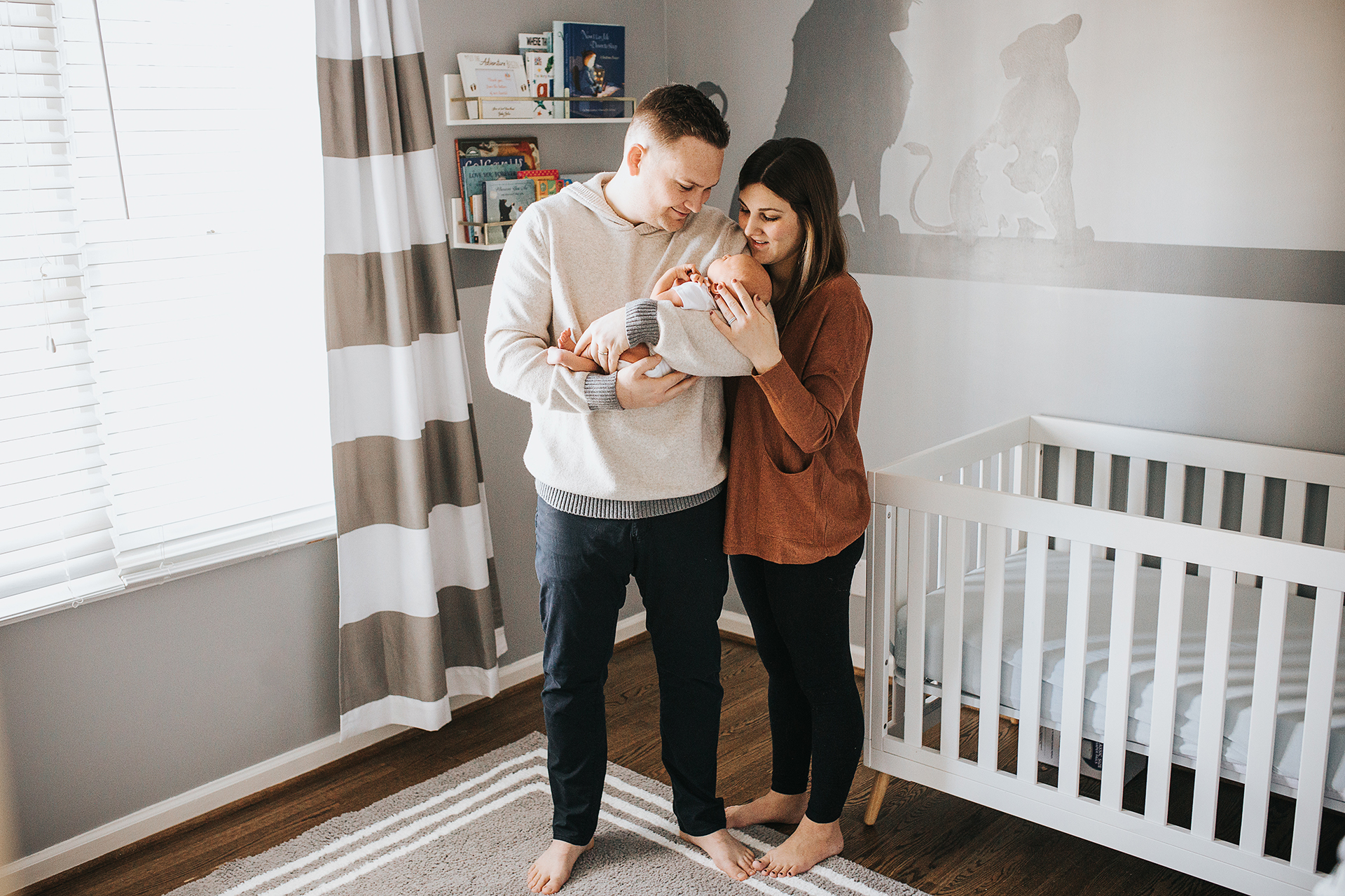 family in nursery- apex lifestyle newborn photography