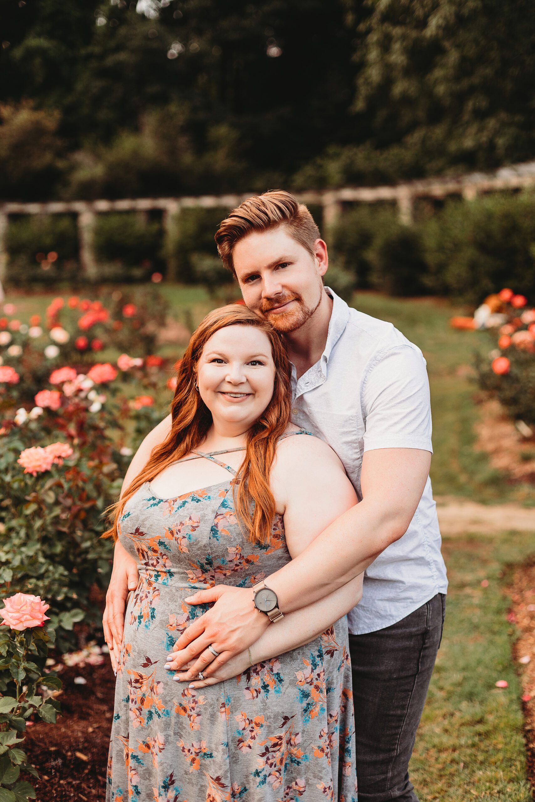 Pregnant couple raleigh rose garden photoshoot