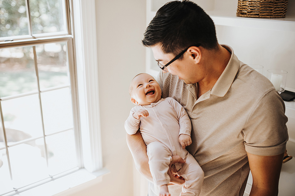 baby smiling at dad