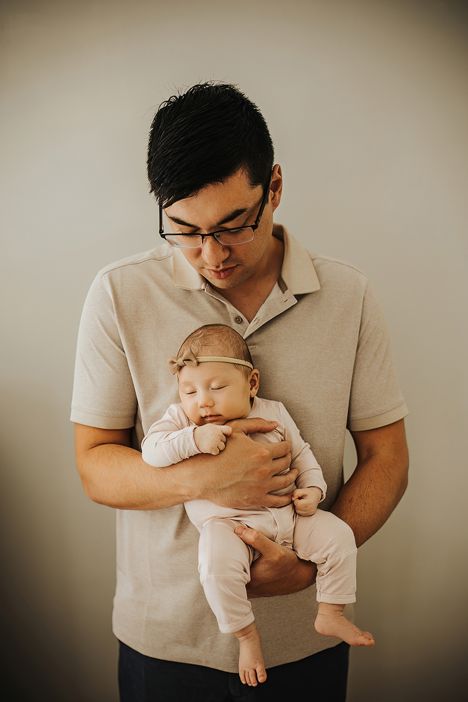 sleeping baby in dad's arms