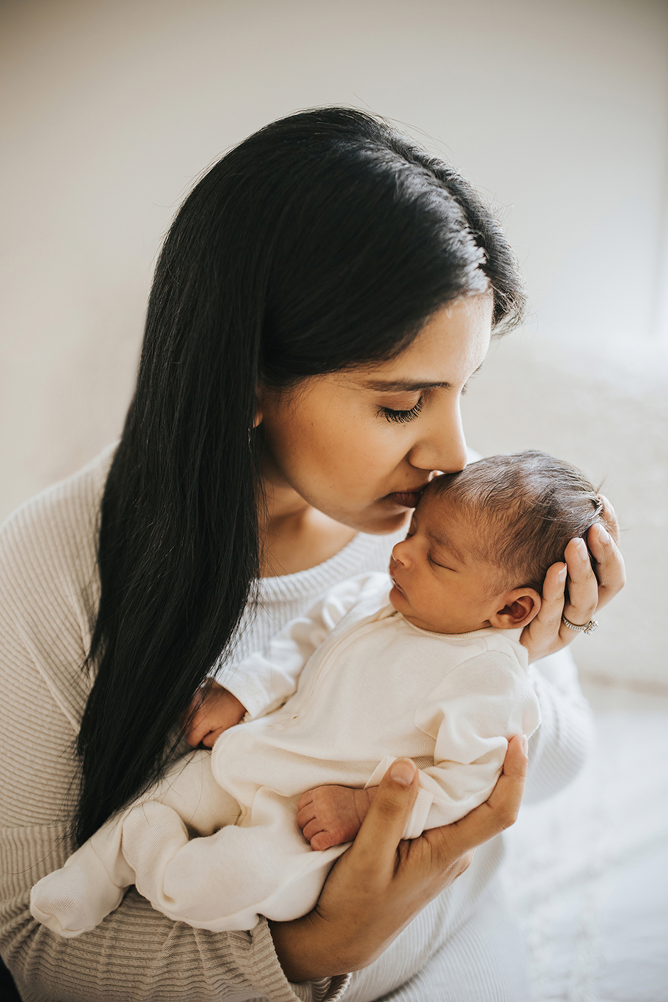 mom kissing newborn baby, lifestyle newborn photography raleigh, Laura Karoline Photography