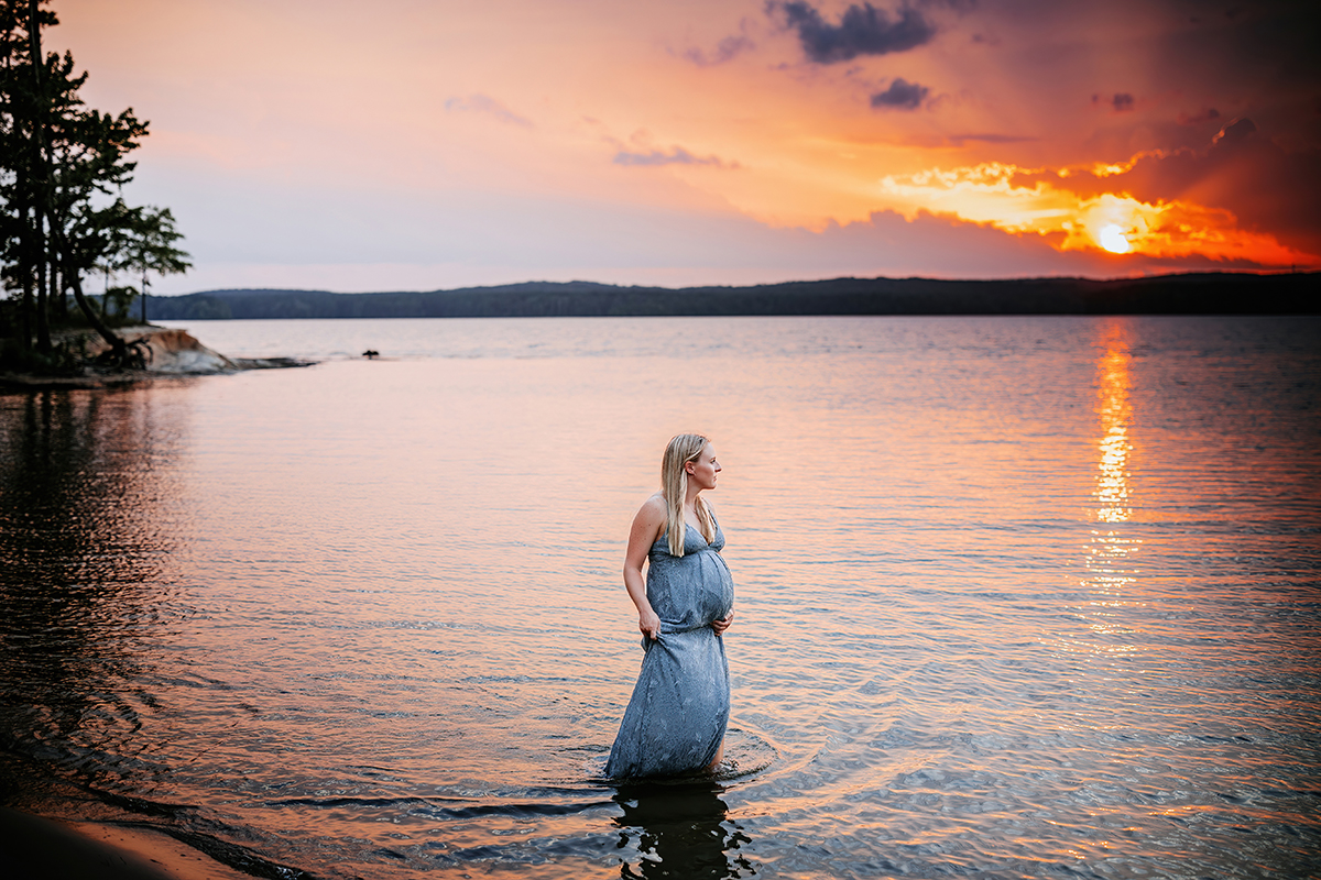 sunset maternity photos of woman in lake, jordan lake maternity photos, laura karoline photography