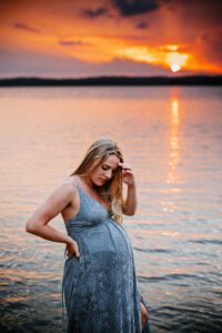 pregnant mother in lake at sunset, jordan lake maternity photos, laura karoline photography