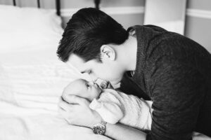 dad and newborn baby touching noses in black and white, Holly Springs Lifestyle Newborn Photos, Laura Karoline Photography