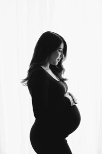 black and white silhouette of pregnant mom, classic maternity portrait, studio maternity photos raleigh