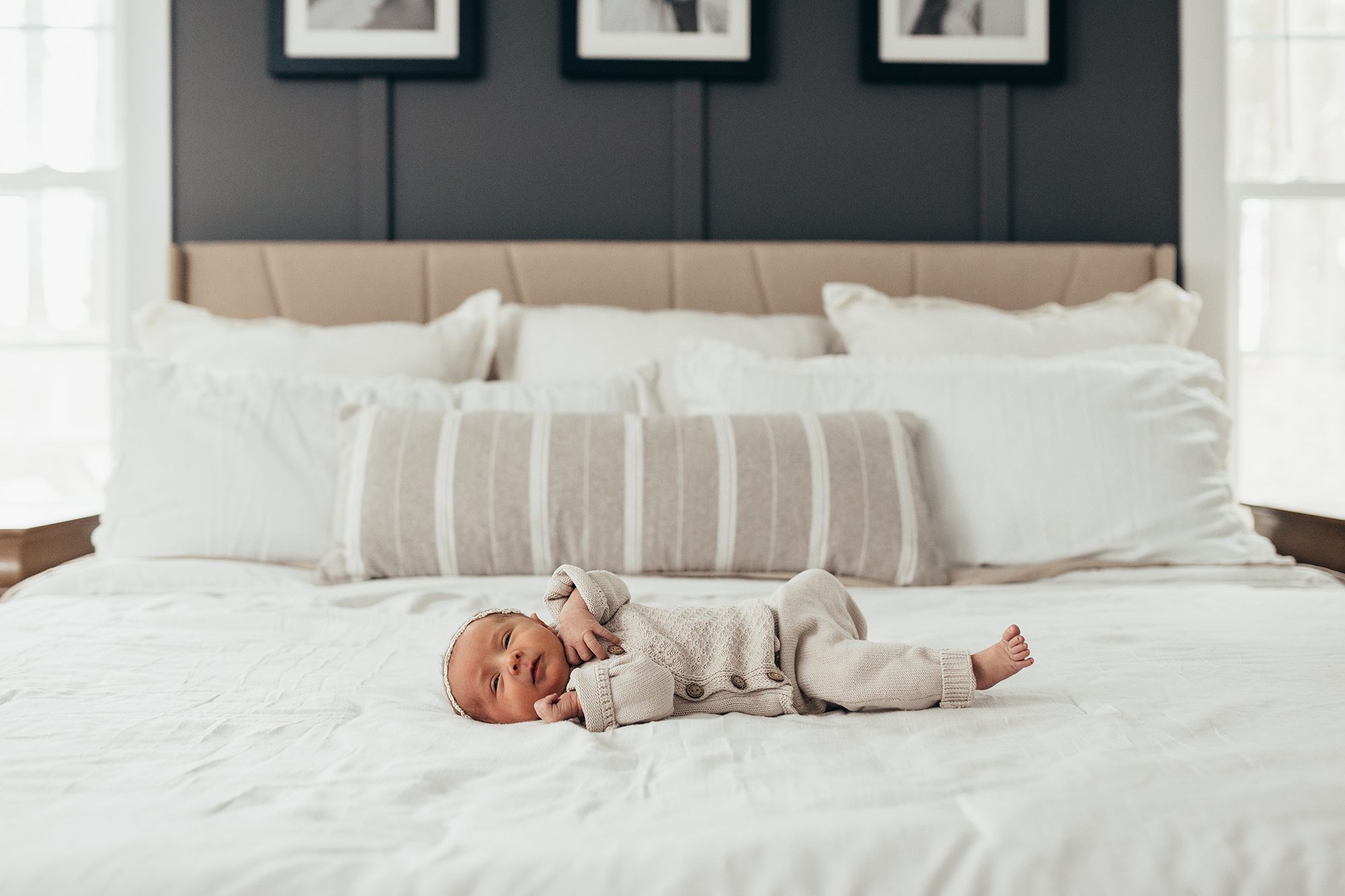 lifestyle newborn photos in apex, newborn baby on bed