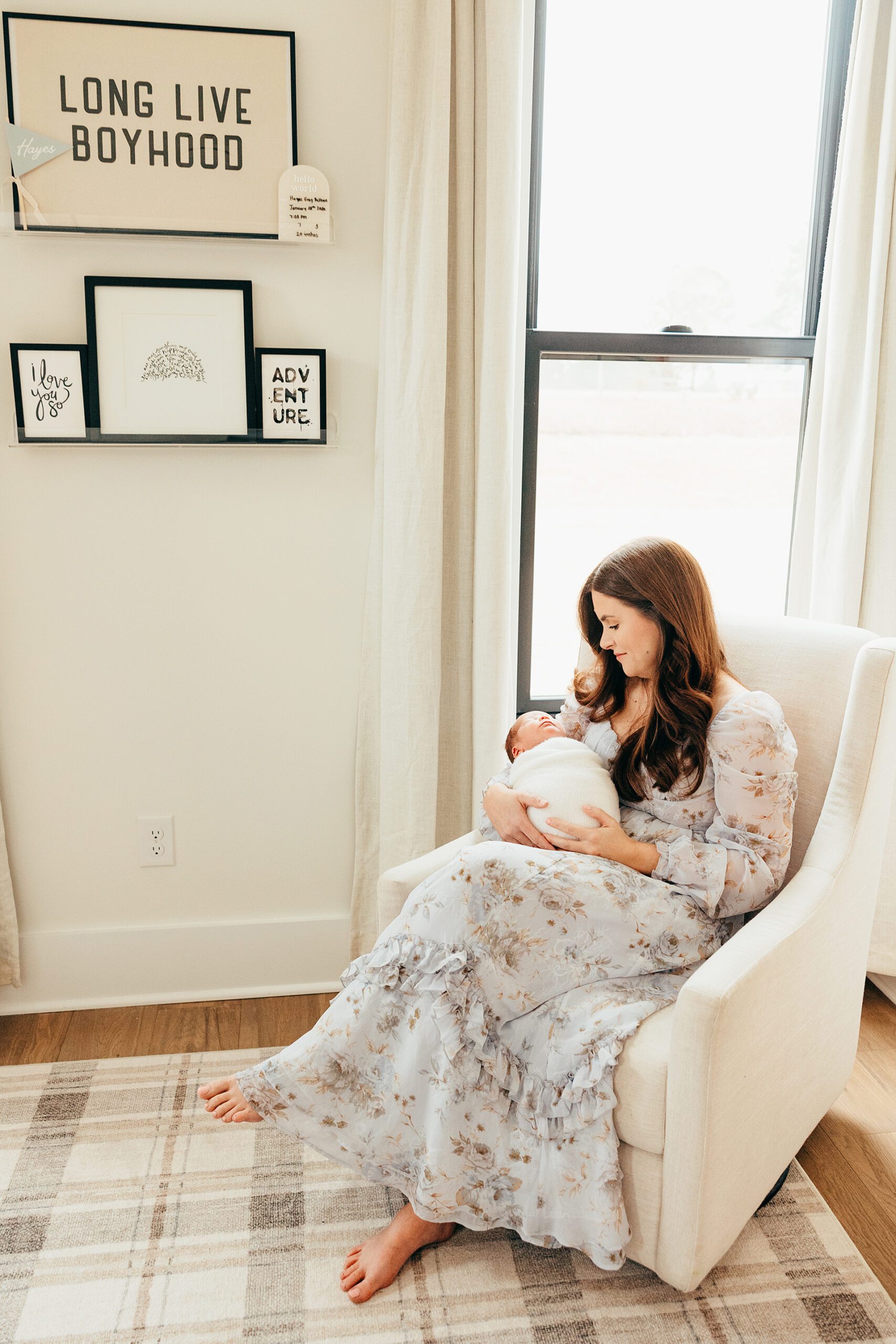 mom rocking with baby in nursery
